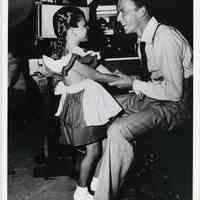 B+W photo of Frank Sinatra with daughter Nancy, in a radio or film studio, n.p., n.d., ca. 1945.