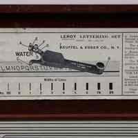          detail of label with scriber model depicted
   