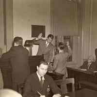 Digital image of b+w photo of Mayor Fred M. DeSapio swearing in an unidentified man at City Hall, Hoboken, no date, ca. 1947-53.