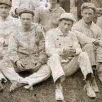          detail men seated front center
   