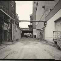 B+W photo of former Maxwell House Coffee plant exterior, looking north between Extraction Building & Storage Silos, Hoboken, 2003.