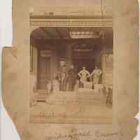 Sepia-tone photo of exterior of J. Widmann business, no place, no date, ca. 1900.