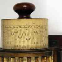          detail right end of cylinder with patent name & date
   