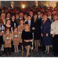 Color photo of Cunning family group posed in church, Hoboken, n.d., ca. 2000s.