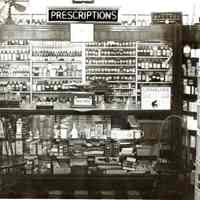 B+W photo of the prescription department of Baron