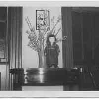 Black-and-white photo of Japanese Girl Guide doll on a table at Hoboken