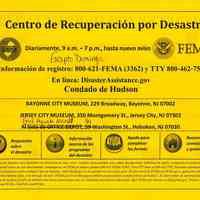 Sign, instructional, bi-lingual: Disaster Recovery Center / Centro de Recuperacion por Desastre. State of N.J. OEM; FEMA. (Issued Hoboken, n.d, ca. Dec. 15, 2012.)