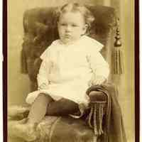 Cabinet photo of a baby posed in photographer