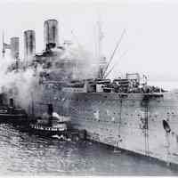 B+W photo of U.S.S. Leviathan approaching dock at Hoboken [Port of Debarkation] with 8,000 troops aboard. N.d., ca. 1918-1919.