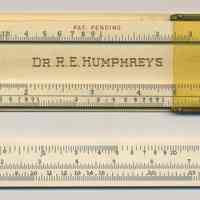          front with slide removed; slide inverted with S L T scales
   