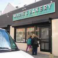 Digital copy of color photo of food tour members outside Marie