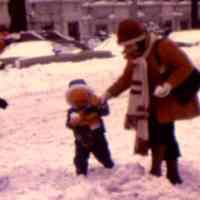          12 child and mother in snow
   