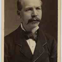 Carte-de-visite of man with mustache posed in photographer