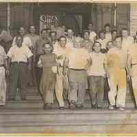 B+W photo of men on stairs exiting a building, Hoboken, no date, circa 1945-1950.