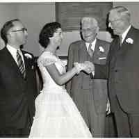 Digital image of B+W photo of Paula Millenthal being congratulated by former Senator Albert Hawkes at commencement, Stevens Hoboken Academy, Hoboken, June 9, 1955.