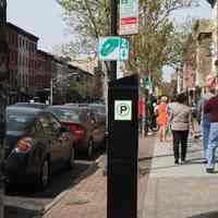          099 side view of Munimeter 10 with parking sign & coin payment symbol sign
   