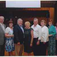 Color photo of Cunning family group posed in church, Hoboken, n.d., ca. 2000s.