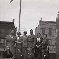 Digital image of B+W negative image ofJulius & Anthony Durstewitz (Senior) and seven women (family?) on a roof, Hoboken. no date, circa 1938-1940.