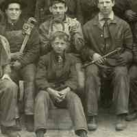          detail center with Harry A. Bremer (Jr.) seated on tool box at center
   