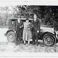 Black-and-white photocopy of photo of August & Gesina Engelbart plus a man standing in front of an automobile, no place, n.d., ca. 1940.