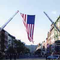          Tenth and Washington, Veterans Day Parade; flag, ladder firetrucks
   