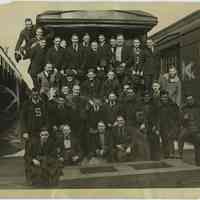 B+W photo of Stevens Institute of Technology students posed at passenger car at Lackawanna Terminal before leaving to break strike, Hoboken, Apr.14, 1920.