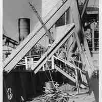 B+W photo of a workman on a damaged upper deck, Hoboken, no date, ca. 1940.