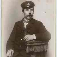 Cabinet photo of Hamburg-American Line officer or crew member posed in uniform, Hoboken, n.d., ca. 1899-1910.