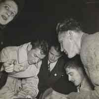 B+W photo of Frank Sinatra signing autographs on City Hall steps, Hoboken, October 30, 1947.