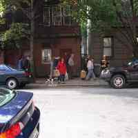 Digital copy of color photo of food tour members walking to a tour stop, Hoboken, Oct. 18, 2003.