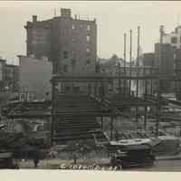 Sepia-tone photo of steel frame erection on the site for the Fabian Theatre, southeast corner of Newark & Washington Sts., Hoboken, Feb. 6, 1928.