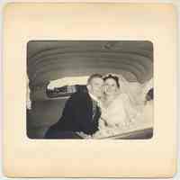 B+W photo of Edward Cunning and Joan Smith Cunning inside car after wedding ceremony, Hoboken, 1955.