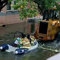          14_justin_&_melissa Pasquariello_sandy 2012 (boat towed by payloader)
   