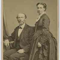 Cabinet photo of a man & woman posed in photographer