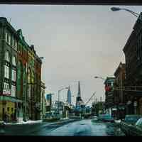 Color slide of eye-level view of row houses on 14th looking E from Bloomfield showing Mario