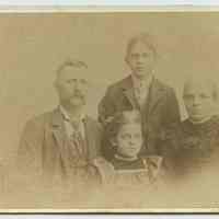 Cabinet photo of a family of 4 posed in a studio, Hoboken, n.d., ca. 1895-1905.