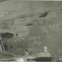 B+W photo of interior view of hull plate and structural repairs underway on unidentified vessel at the Bethlehem Steel Shipyard, Hoboken Division, no