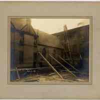 Sepia-tone photo of construction site next to church, probably Hoboken; Hoboken contractor pile driver, Feb. 9, 1909.