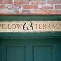 Color photo detail of the tiled address sign over the main entrance to 63 Willow Terrace, Hoboken, Sept., 1-5, 2001.