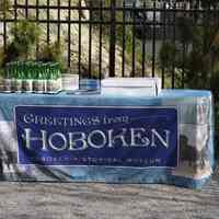          079 museum table with tablecloth, commemorative bottled water and cake
   