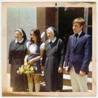 Color photo of Edward Cunning Jr. (right) in front of Our Lady of Grace Church Hall at time of confirmation, Hoboken, New Jersey, no date, ca. 1970.