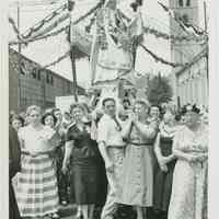 B+W photo of procession with Madonna being carried on 7th St. next to St. Ann