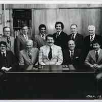 B+W photo of R. Neumann & Co. executives posed in President