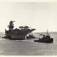 B+W photo of U.S.S. Intrepid arriving Bayonne for museum conversion; work to be done by Bethlehem Steel Hoboken Shipyard, Feb. 25, (1981?)