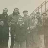 B+W group photo of "On the Waterfront" filming in Hoboken: Marlon Brando is third from the left. Others are unidentified. No date, ca. Nov-Dec. 1953.