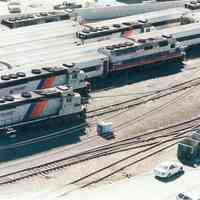 Digital image of color photo of an aerial view of New Jersey Transit passenger trains locomotives in the yard, Hoboken Terminal, Hoboken, Sept. 2002.