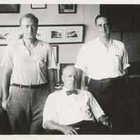 B+W photo of R. Neumann & Co., three men in an office, Hoboken, no date, ca. 1950-60.