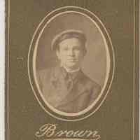 Sepia-tone photo of an unidentified boy posed in studio, Hoboken, no date, ca. 1890-1910.