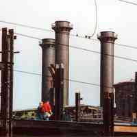 Digital image of color photo of the roof edge and smokestacks of the former Hudson & Manhattan Rail Road powerhouse, Jersey City, May, 2001.