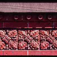 Color slide of close up-view of decorative tile on one of the buildings between 725 and 731 Washington between 7th and 8th